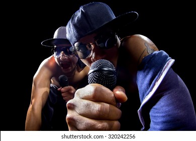 Rappers Having A Hip Hop Music Concert With Microphones.  The Arrogant Musician Is Having A Concert In A Nightclub.  