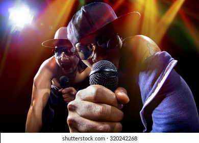 Rappers Having A Hip Hop Music Concert With Microphones.  The Arrogant Musician Is Having A Concert In A Nightclub.  