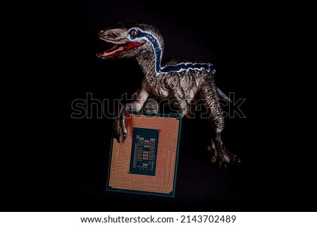 Raptor Lake codenamed processor illustration. The velociraptor holds the CPU in its paws