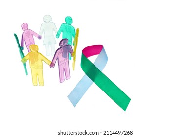Rare Disease Day Background. Colorful awareness ribbon with group of people with rare diseases. - Shutterstock ID 2114497268
