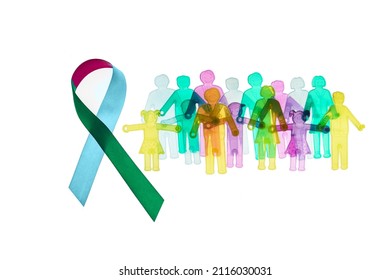 Rare Disease Day Background. Colorful awareness ribbon with group of people with rare diseases. - Shutterstock ID 2116030031