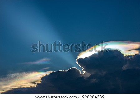 A Rare Look at an Iridescent Cloud. fire rainbows or rainbow clouds. Iridescent Pileus Cloud colorful optical phenomenon sky