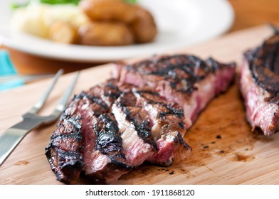 Rare Rib Steak Cooked To Perfection On A Grill