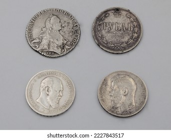 Rare silver coins of Russian Empire on grey background