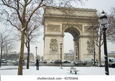 Rare Snowy Day In Paris. Arc De Triomphe And Lots Of Snow