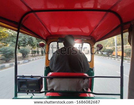 rare view Close up shot of indian auto rickshaw or rickshaw driver or tuktuk driver 
