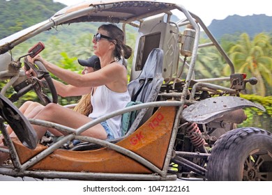 RAROTONGA - DEC 16 2017:Action Woman Driving A Dune Buggy On A Safari Adventure Tour.According To Insurance Companies Research, Women Are Less Aggressive And More Law-abiding Drivers Then Men