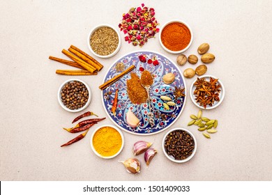 Ras el Hanout, exotic luxury spice. Ingredients for preparation oriental spice mix in ceramic bowls. An essential spice for any Moroccan dishes. Stone background, top view, copy space - Powered by Shutterstock