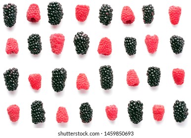 Rasberry And Blackberry Fruits On White Background As Texture Background