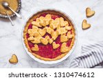 Raspberries jam pie with heart shape decorations. Delicious festive cake for Valentine