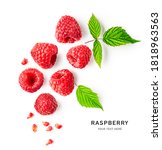 Raspberries and leaves creative layout isolated on white background. Healthy food and dieting concept. Summer raspberry fruits composition. Top view, flat lay, copy space