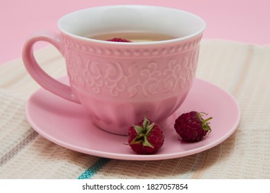 Raspberries And Pink Tea Cup On A Tea Towel.Flat Lay Of Tropical Summer. Food Concept