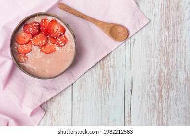 Raspberry Banana Smoothie Bowl Topped With Raspberries, Banana, Coconut And Goji Berries