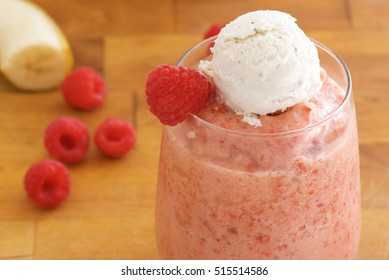 Raspberry, Banana Smoothie With Ice Cream On Top And Fresh Raspberry 