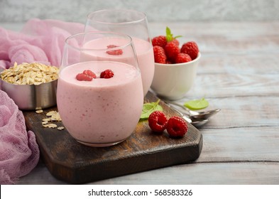 Raspberry And Banana Smoothie With Oatmeal On The Rustic Wooden Table, Selective Focus, Horizontal, Copy Space