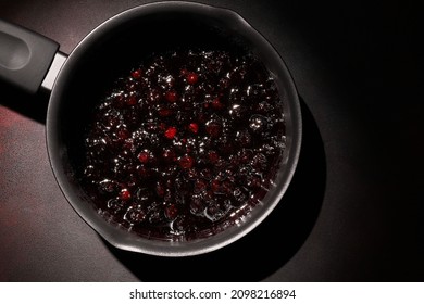 Raspberry And Blueberry Jam In A Pot On Dark Background. Making Jam At Home. Homemade Preserve. 