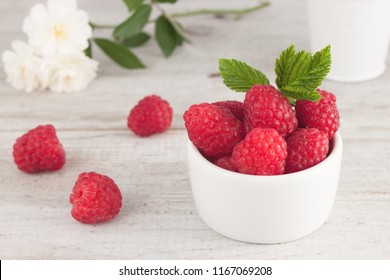 Raspberry in bowl. Raspberry on light bacground with copy space for text. Organic Raspberry. Red berry. Still life