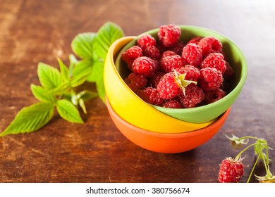 raspberry in a bowl on a table, selective focus
