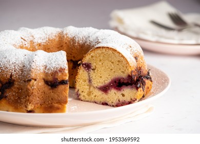 A Raspberry Breakfast Bundt Cake With A Powdered Sugar Dusting On Top Ready To Be Served.