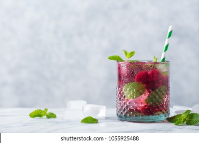 Raspberry Cocktail, Fizz, Lemonade, Ice Tea With Fresh Mint On Marble Background. Copy Space.