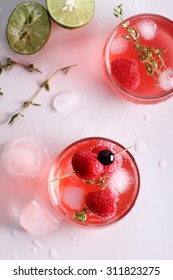 Raspberry Cocktail In A Glass With Fresh Berry And Thyme, Top View
