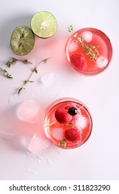 Raspberry Cocktail In A Glass With Fresh Berry And Thyme, Top View
