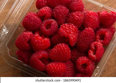 
raspberry in a container ready for consumption