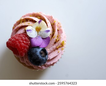Raspberry cupcake with fruit top view