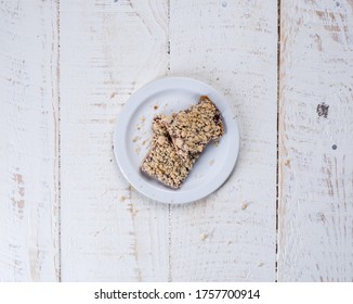 Raspberry Dessert Bars On Rustic White Surface.