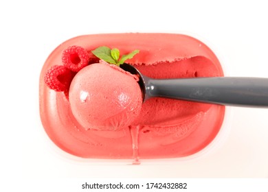 Raspberry Ice Cream In Box And Spoon