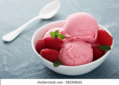 Raspberry ice cream in white bowl close  up - Powered by Shutterstock