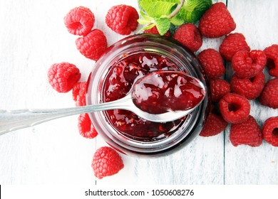 Raspberry Jam With Fresh Raspberries And Mint. Marmalade On Spoon And Jar.