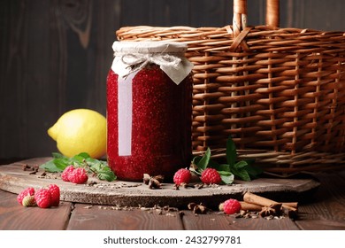 Raspberry jam in glass can with fresh berry, mint and spices on wood and rustic background, cottagecore aesthetic, copy space, batch cooking, sustainable living, zero waste storage concept - Powered by Shutterstock