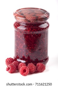 Raspberry jam in jars on a white background
