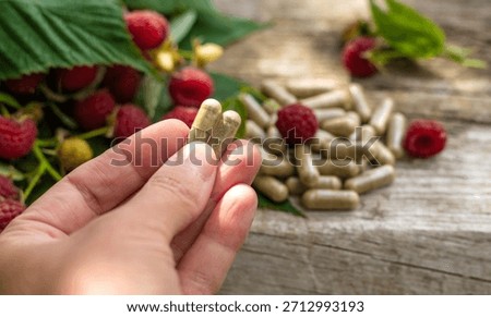 Raspberry leaf extract and supplements. Selective focus. Food.