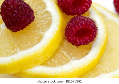 Raspberry And Lemon Isolated On White