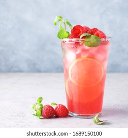 Raspberry Lemonade With Lime And Ice. Cold Refreshing Cocktail