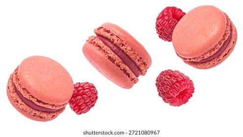Raspberry macarons flying with fresh berries isolated on white background, full depth of field