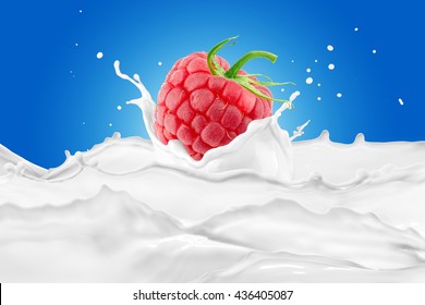 Raspberry With Milk Splash On Blue Background