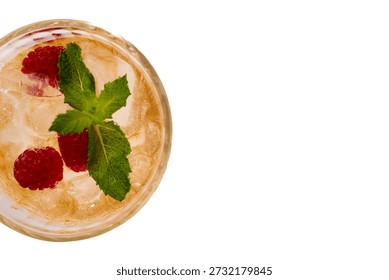 Raspberry mint cocktail with ice cubes, a cooling beverage for summer drinks, high angle view with ample copy space