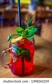 Raspberry Mocktail With Fresh Raspberries  And Mint And Lemon Garnish