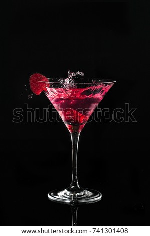 Raspberry splash in a martini glass	