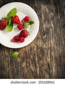 Raspberry and strawberry on plate