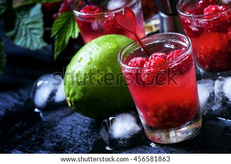 Raspberry-lime chilled lemonade, dark background selective focus