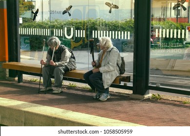 Rasstat, Germany - September 13, 2017: Maintaining Health For Elderly. Heel-and-toe Walk. Women With Ski Poles Stop. On Glasses Stop Caused Silhouettes Of Birds Of Prey To Broken Birds And People