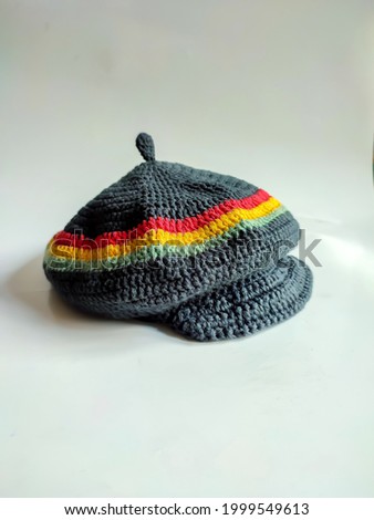 Rasta pattern flat cap with distinctive red, yellow green color stripes, taken with angel front