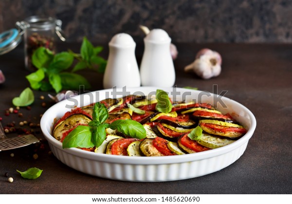 Ratatouille - a\
traditional vegetable dish of French cuisine. Ratatouille dish of\
eggplant, zucchini and\
tomatoes.