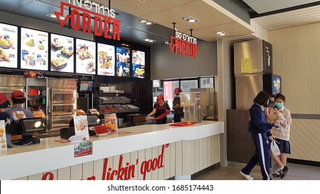 Ratchaburi ,Thailand .March 27th 2020. A Few Customer At The Chicken Fried Fast Food Store And Staff Wear Face Mask To Service For Hygiene And Prevent Virus Pandemic .