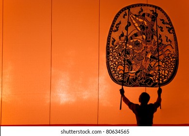 RATCHBURI, THAILAND - APRIL 13: Large Shadow Play is performed at Wat Khanon on April 13, 2011. The ancient performing art involves manipulating puppets of cowhide in front of a backlit white screen - Shutterstock ID 80634565