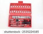 The Ratchet Socket Wrench Set includes various sockets, an extension bar, and a grip handle, providing versatility and ease for your hand tool needs